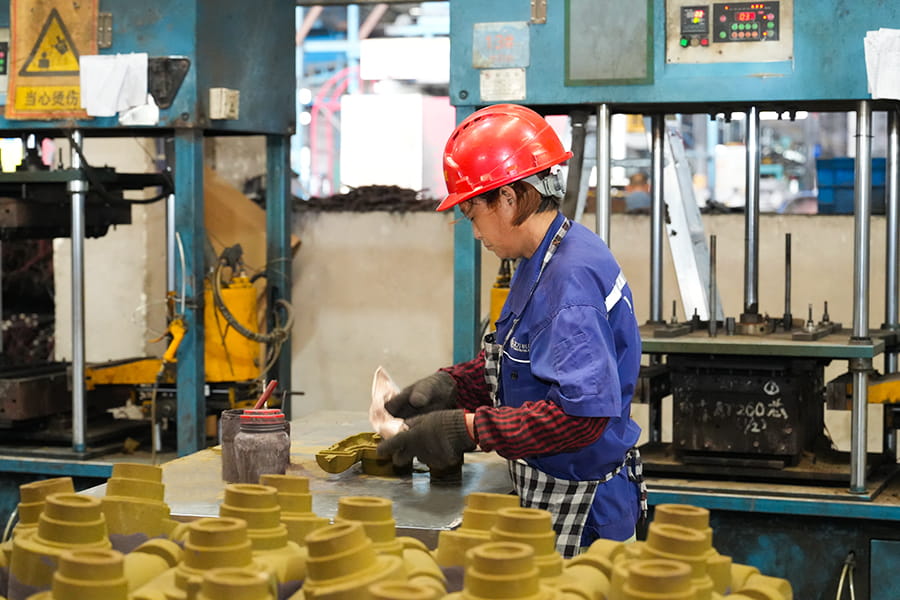 Herstellung von beschichteten Sandkernen