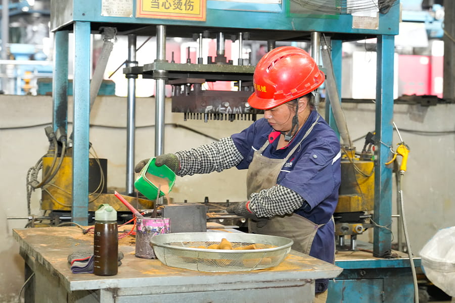Herstellung von beschichteten Sandkernen